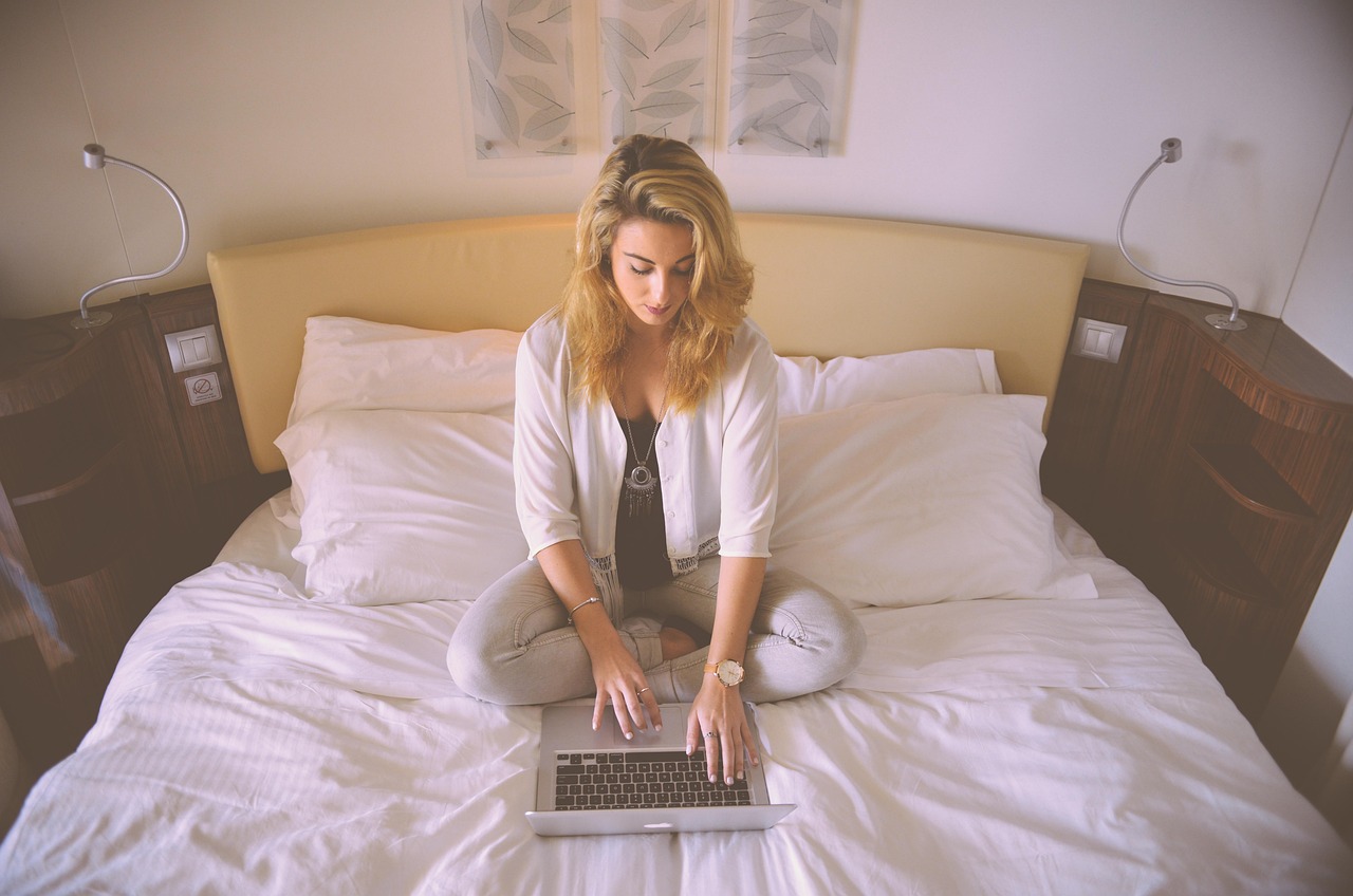 Woman, working, bed — Specific Reasons To Create Baldwin County Bail Bonds System